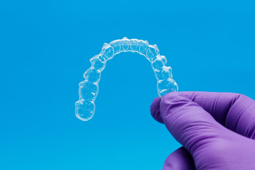 Invisalign clear aligners patient smiling orthodontic treatment